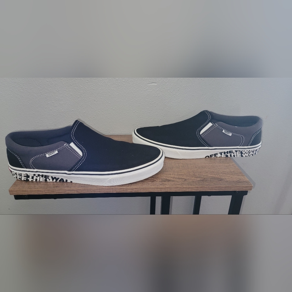 Black and gray Vans Slip Ons